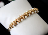 Oval Brushed Gold Bangle with Double Rows of Pearls